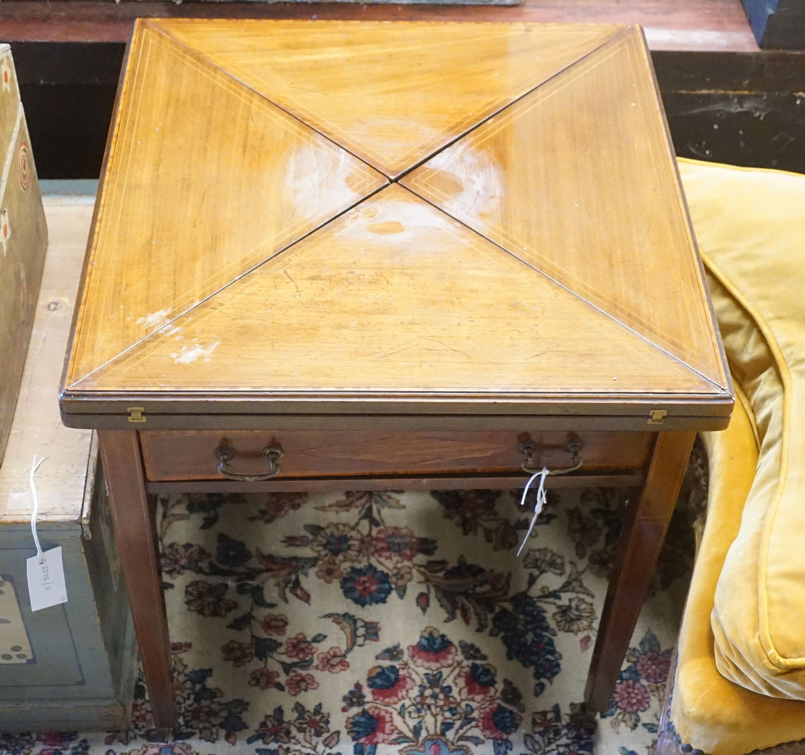 An Edwardian mahogany envelope card table, (cut down), width 56cm, depth 56cm, height 60cm